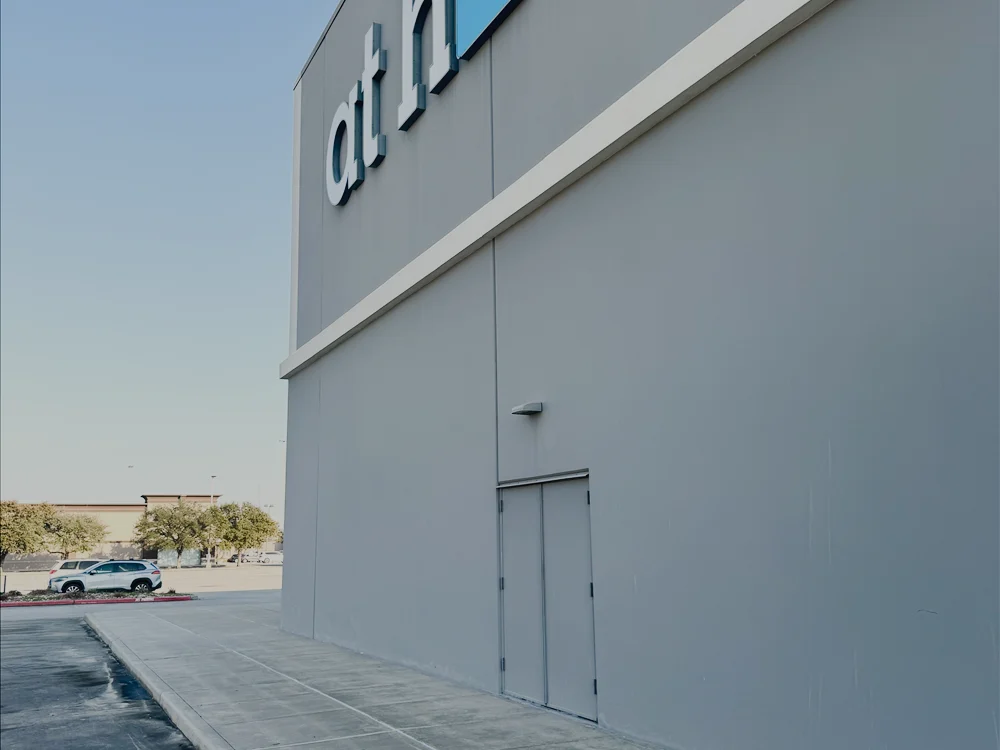 A commercial storefront exterior with clean walkways.
