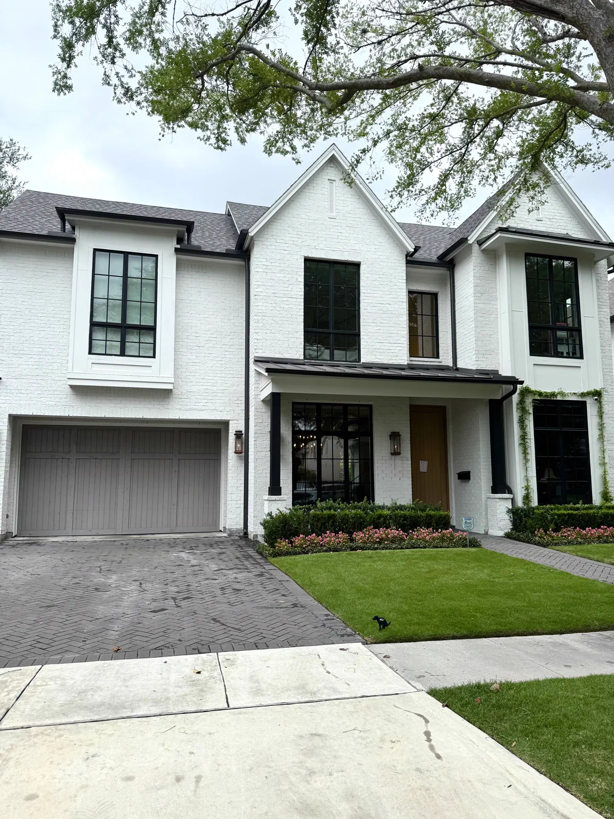 Clean white two-story home exterior and driveway