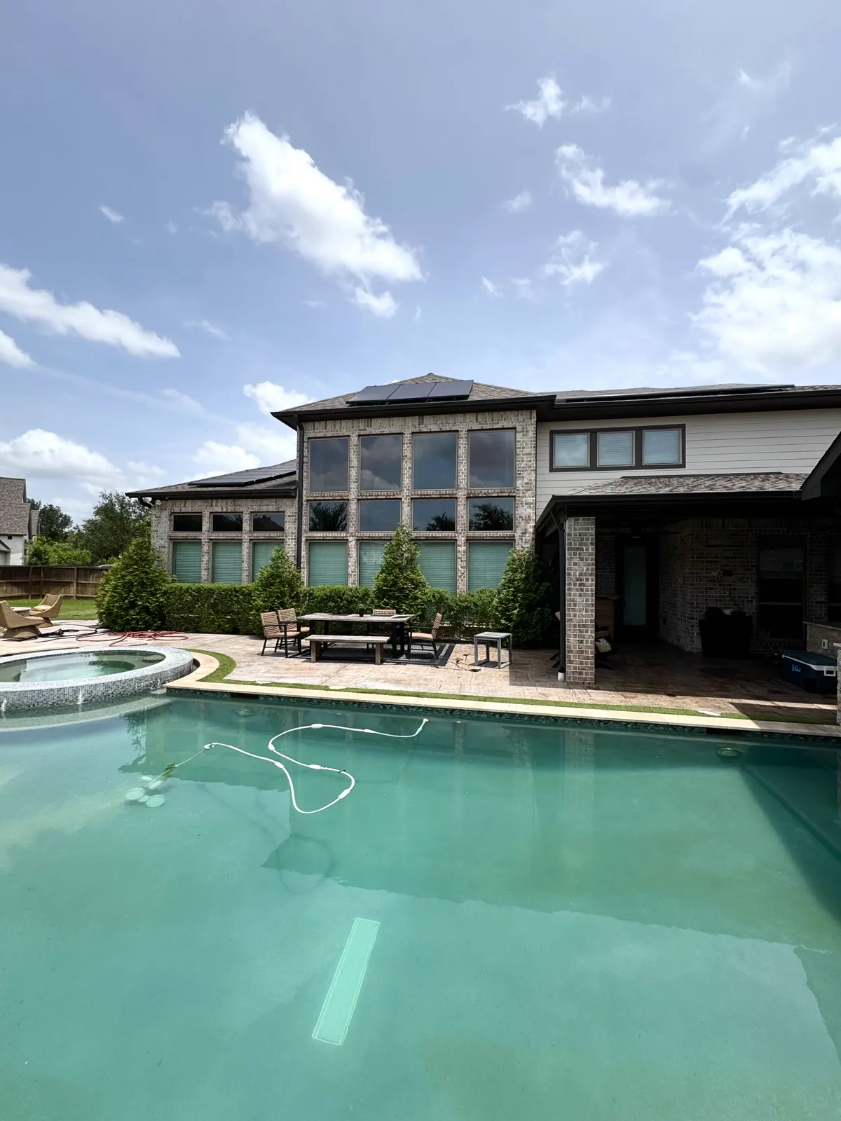 Pool and rear elevation of a Houston-area home