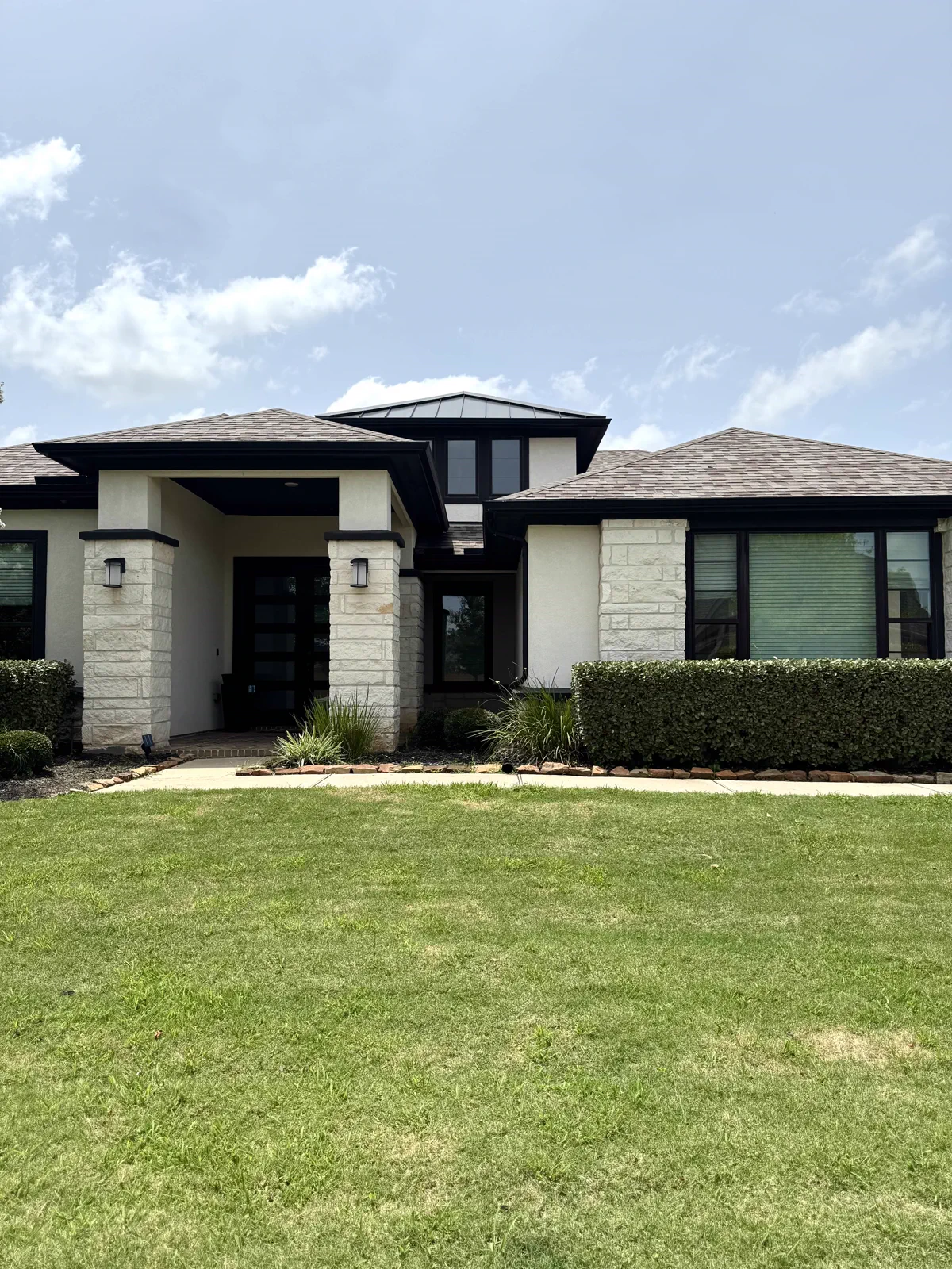 Contemporary gray-and-white home exterior cleaned by Double Tap